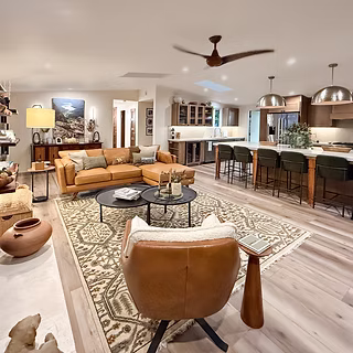 Eclectic kitchen and great room after Snyder Atelier transformation